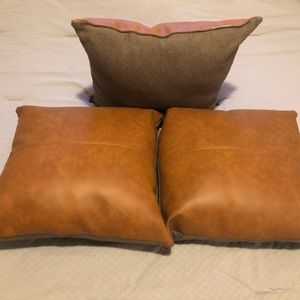Set of 3 tan leather pillows. Purchased from Joann Fabrics.